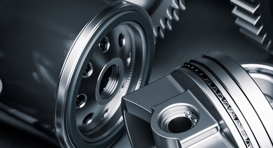 Automotive Manufacturing Close-up of a metal gear interlocked with another gear, showcasing intricate details and mechanical design.