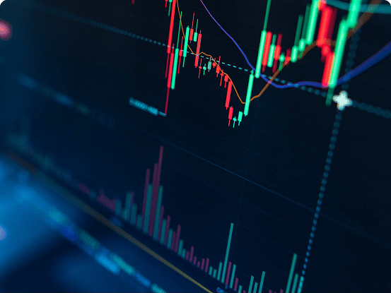 Financial chart with candlestick patterns, volume bars, and trend lines on a dark background.