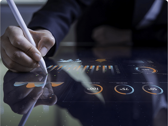 Person using stylus on touchscreen with data visualizations including bar and pie charts