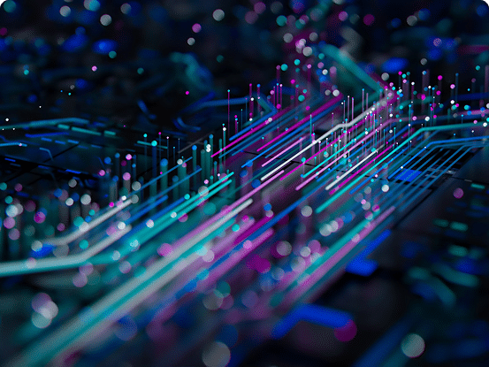 Close-up of a circuit board with glowing blue, purple, and pink electrical pathways.