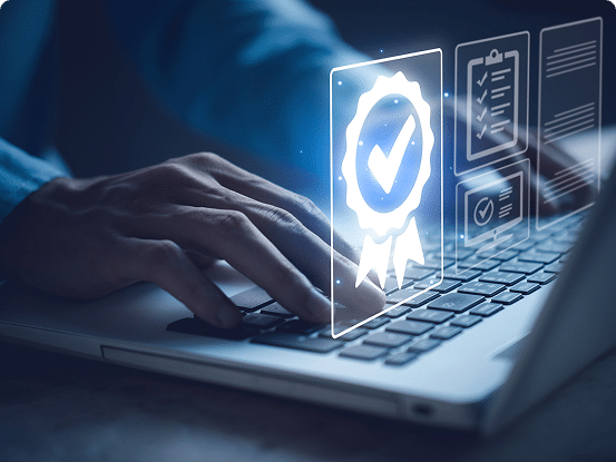 Person typing on a laptop with holographic icons of a certificate and checklists floating above the keyboard.