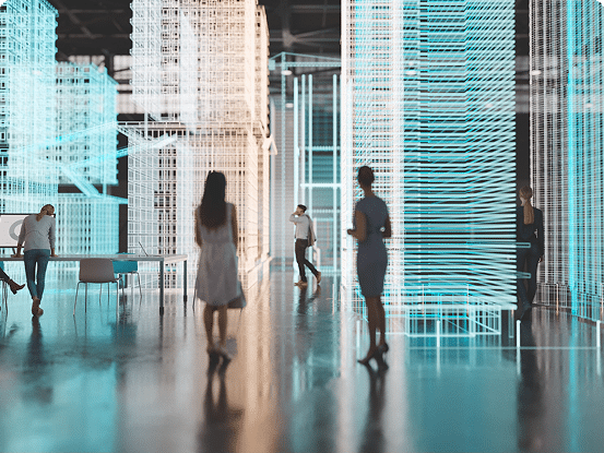 People in a futuristic setting surrounded by holographic architectural structures glowing in blue and white.
